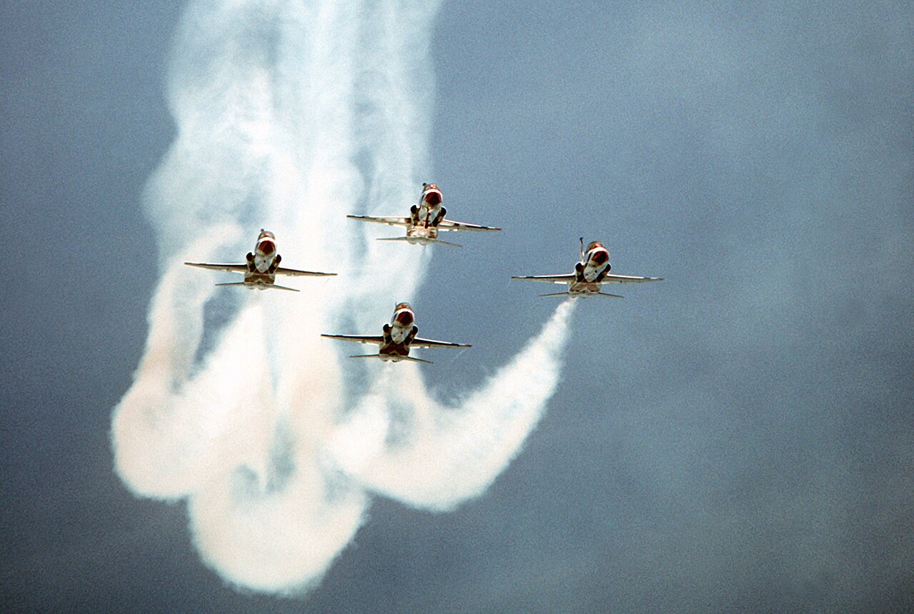 USAF Thunderbirds T-38 diamond formation, 1980 Four USAF Thunderbirds T-38 Talons in diamond formation trailing smoke in 1980