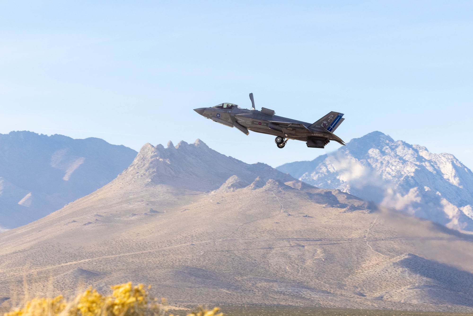 A US Marine Corps F-35B Lightning II departing a forward arming and refueling point