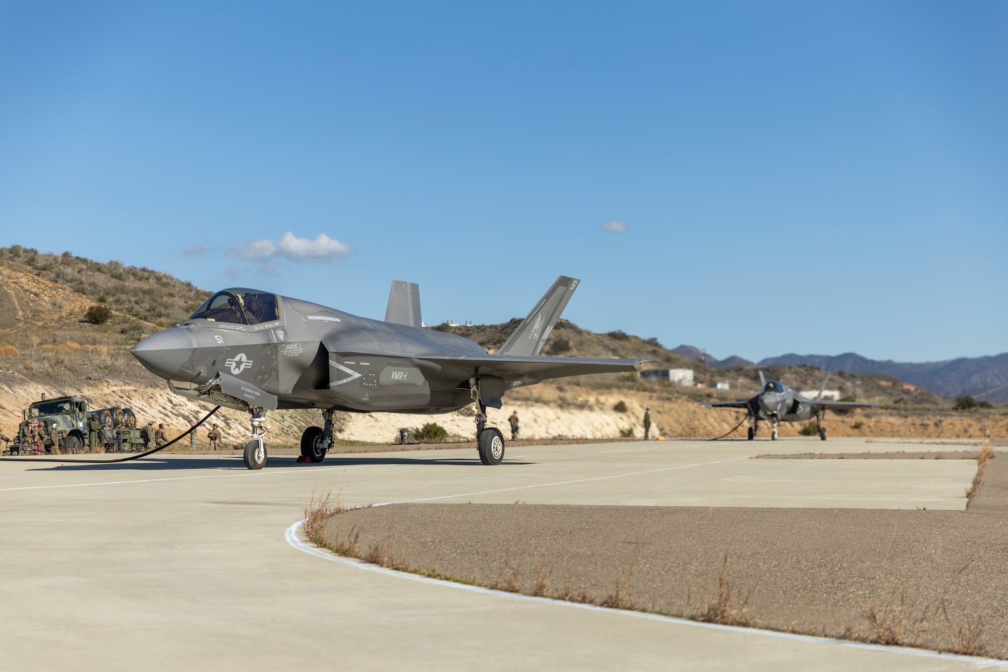 Two US Marine Corps F-35B Lightning IIs taking fuel from a forward arming and refueling point