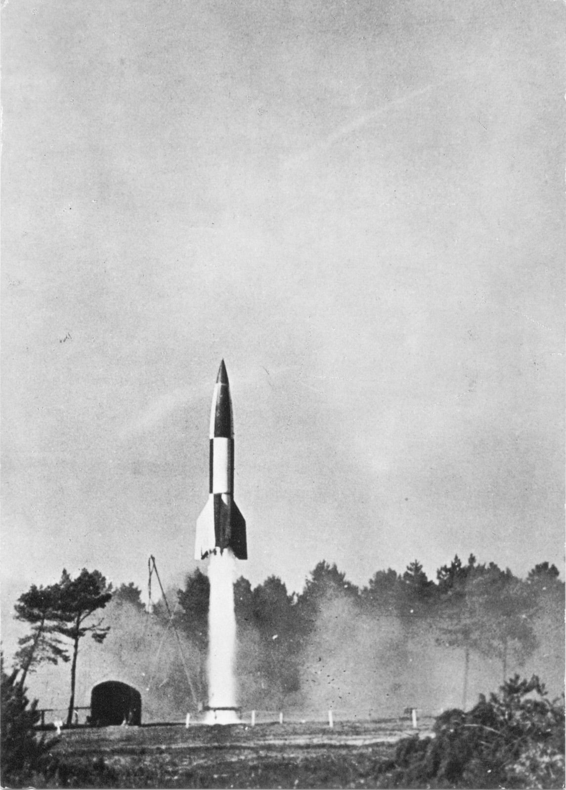 A V-2 rocket lifting off from its launch table on a column of exhaust