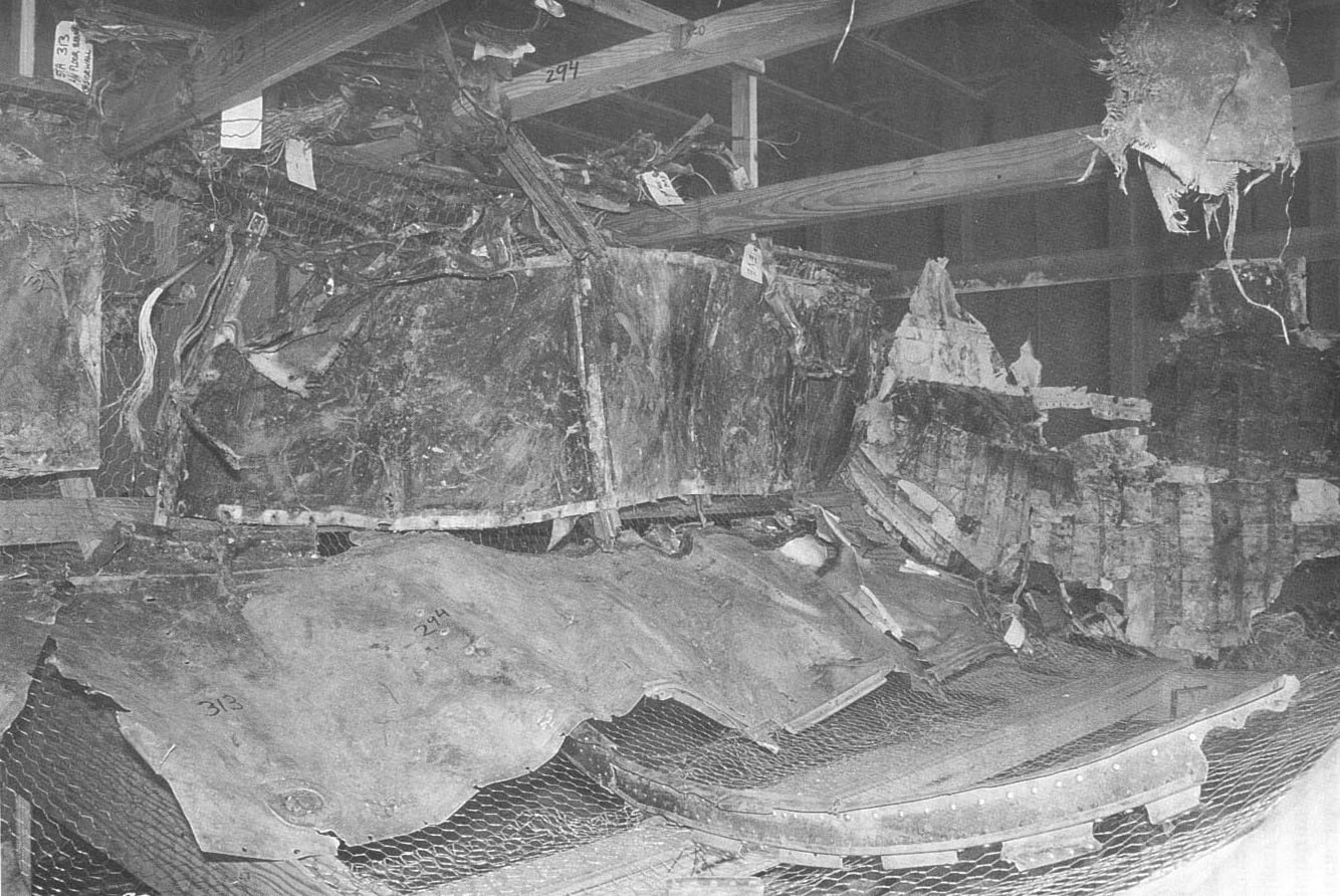 NTSB mockup of the ValuJet Flight 592 DC-9 forward cargo compartment showing recovered wreckage