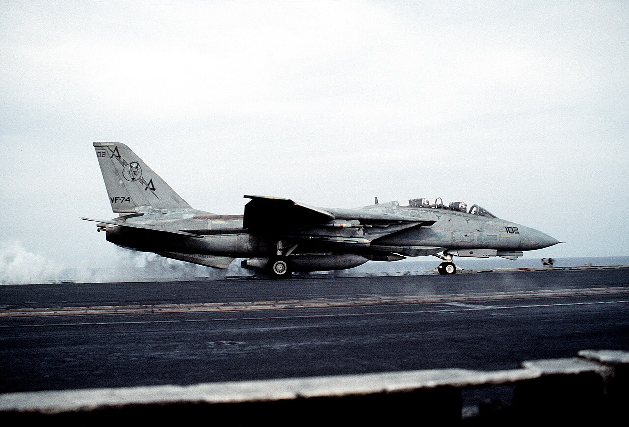 A VF-74 Be-Devilers F-14 Tomcat launching from the deck of USS Saratoga