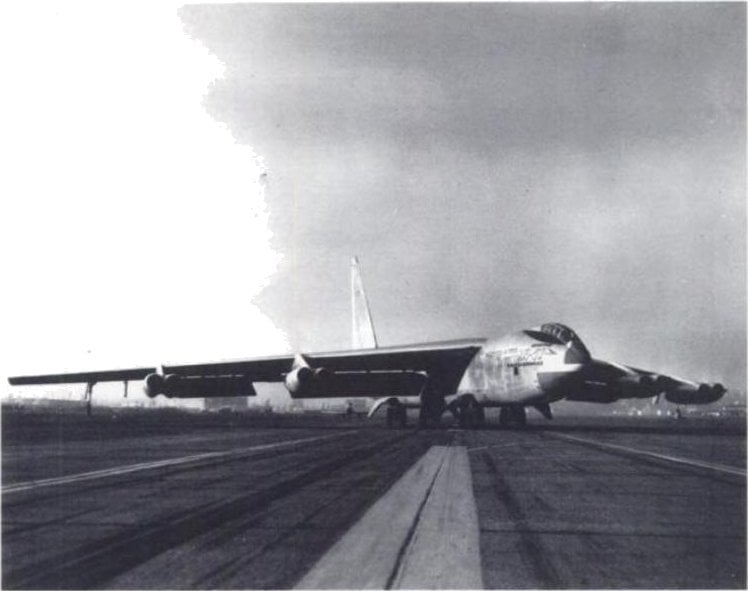 The XB-52 prototype landing crabbed into the wind with its nose angled away from the runway centreline while its wheels roll straight