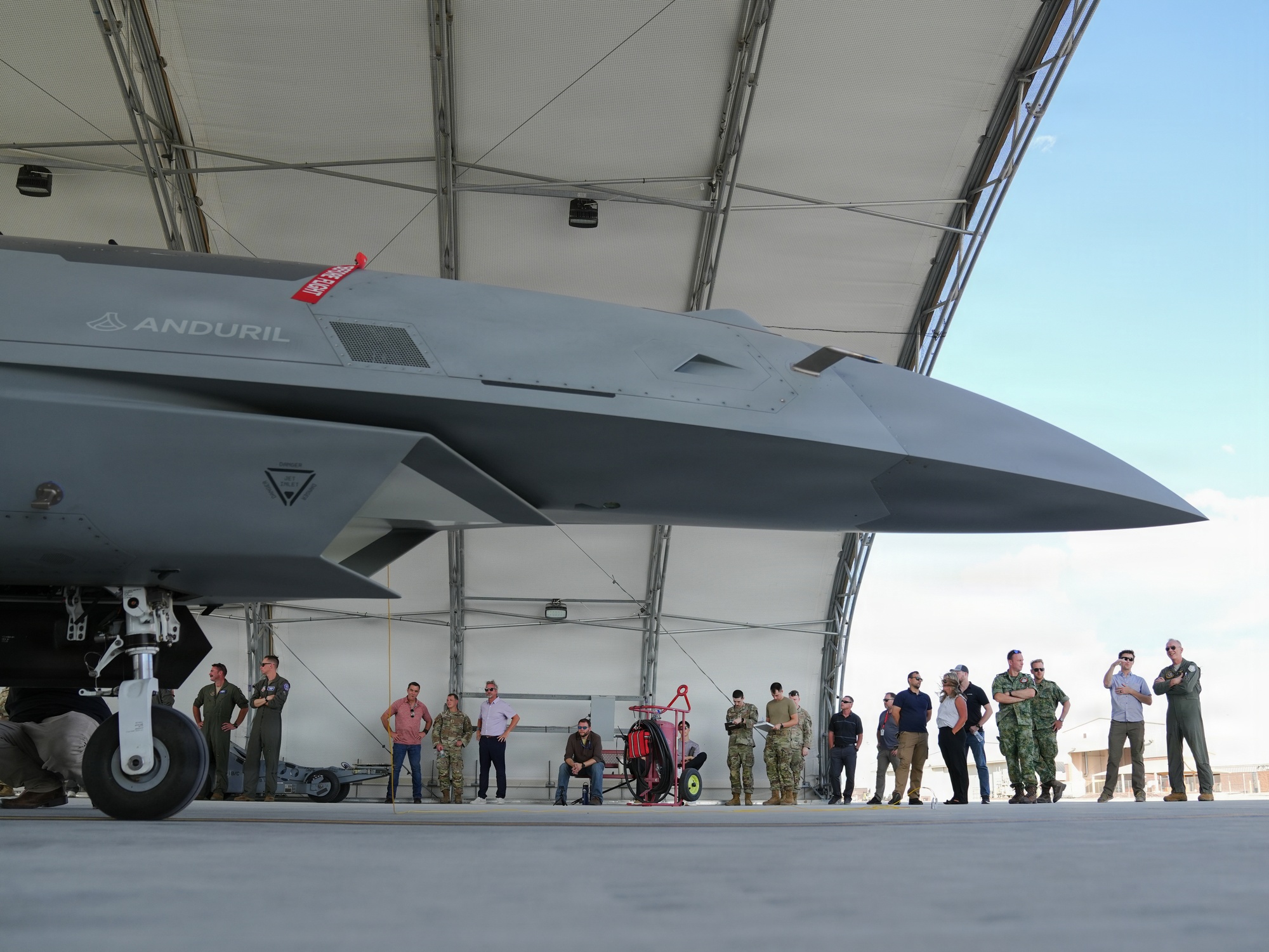 US and Dutch personnel observe a YFQ-44A Fury at Creech AFB