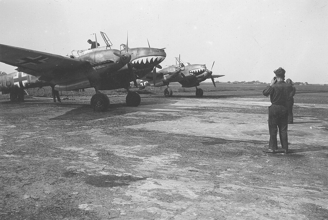 ZG 76 Messerschmitt Bf 110 shark mouth De Kooy 1941 Two Messerschmitt Bf 110 heavy fighters of ZG 76 with shark mouth nose art at De Kooy airfield in 1941