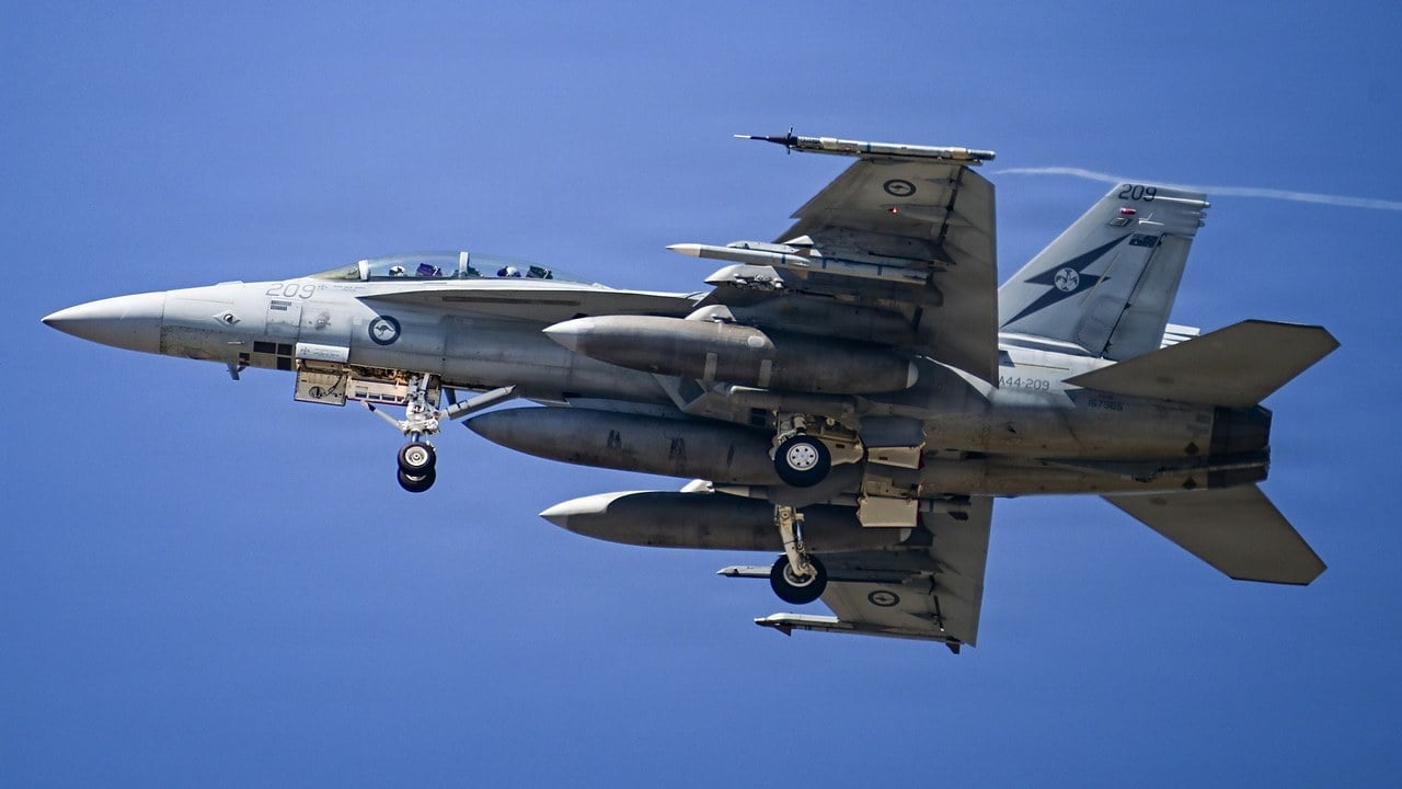 RAAF F/A-18F Super Hornet A44-209 climbing out of Point Mugu with gear extended, three fuel tanks and inert training missiles including an AIM-260