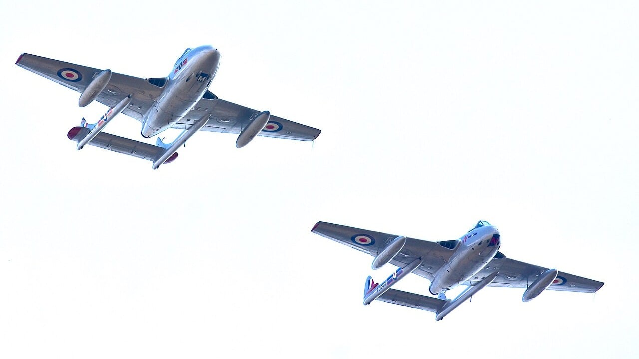 A pair of de Havilland Vampires flying at the Royal International Air Tattoo