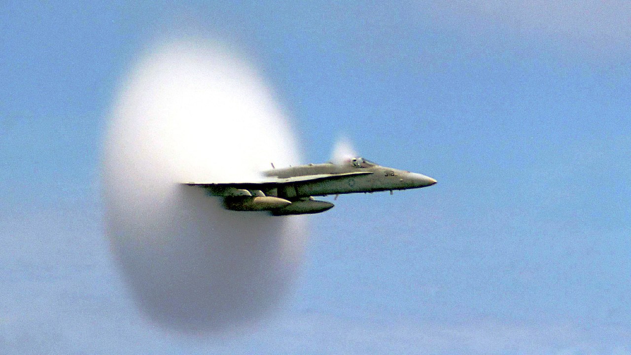 F/A-18 Hornet surrounded by a vapour cone at transonic speed