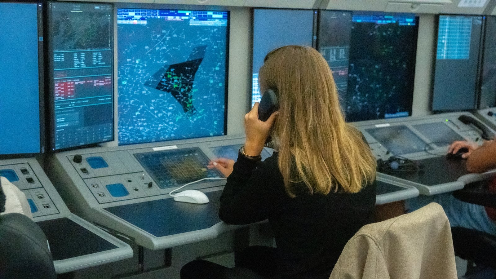 Air traffic controller at a radar working position in the Maastricht Upper Area Control Centre