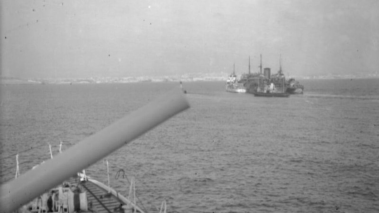 The damaged tanker Ohio, with Royal Navy destroyers alongside, approaching Malta's Grand Harbour on 15 August 1942