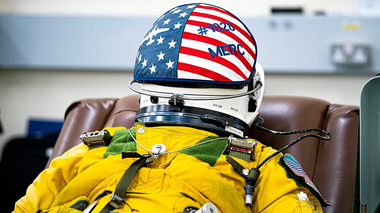 U-2 Dragon Lady pilot in a yellow full-pressure suit and helmet reclined before takeoff