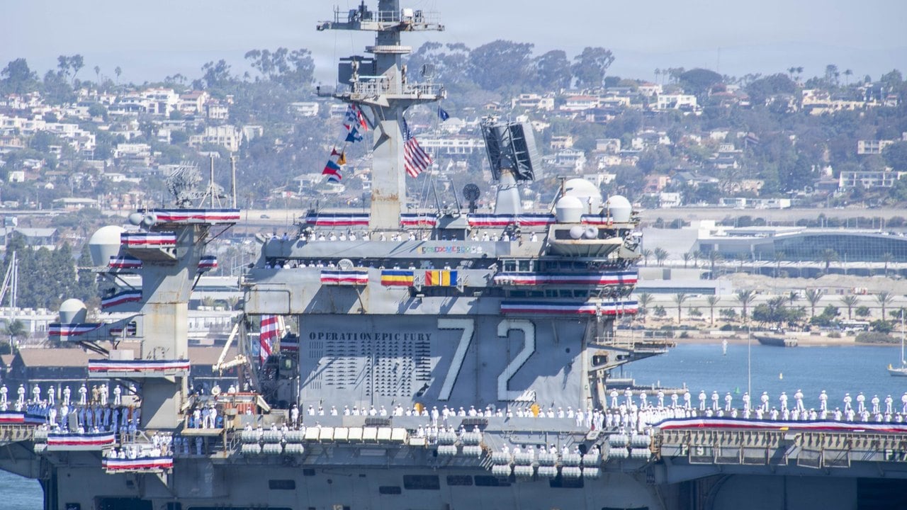 Island of USS Abraham Lincoln CVN 72 covered in Operation Epic Fury kill marks as the carrier returns to San Diego