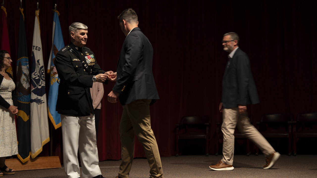 US Marine Corps Gen. Christopher Mahoney handing Wings of Gold to a new naval aviator at NAS Whiting Field