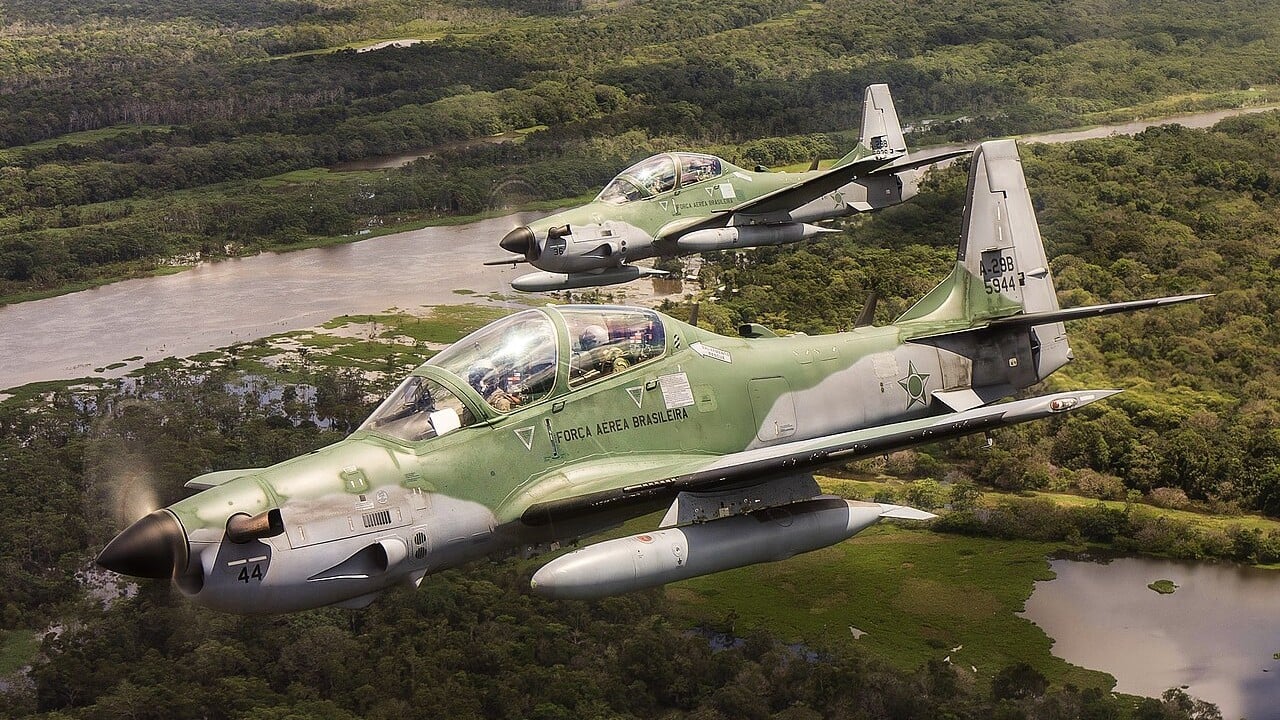 Two Brazilian Air Force A-29 Super Tucanos over the Amazon