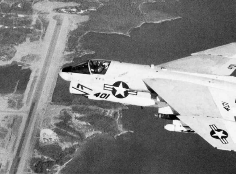 A US Navy A-7E Corsair II of VA-87 flying past the Point Salines runway in Grenada during Operation Urgent Fury