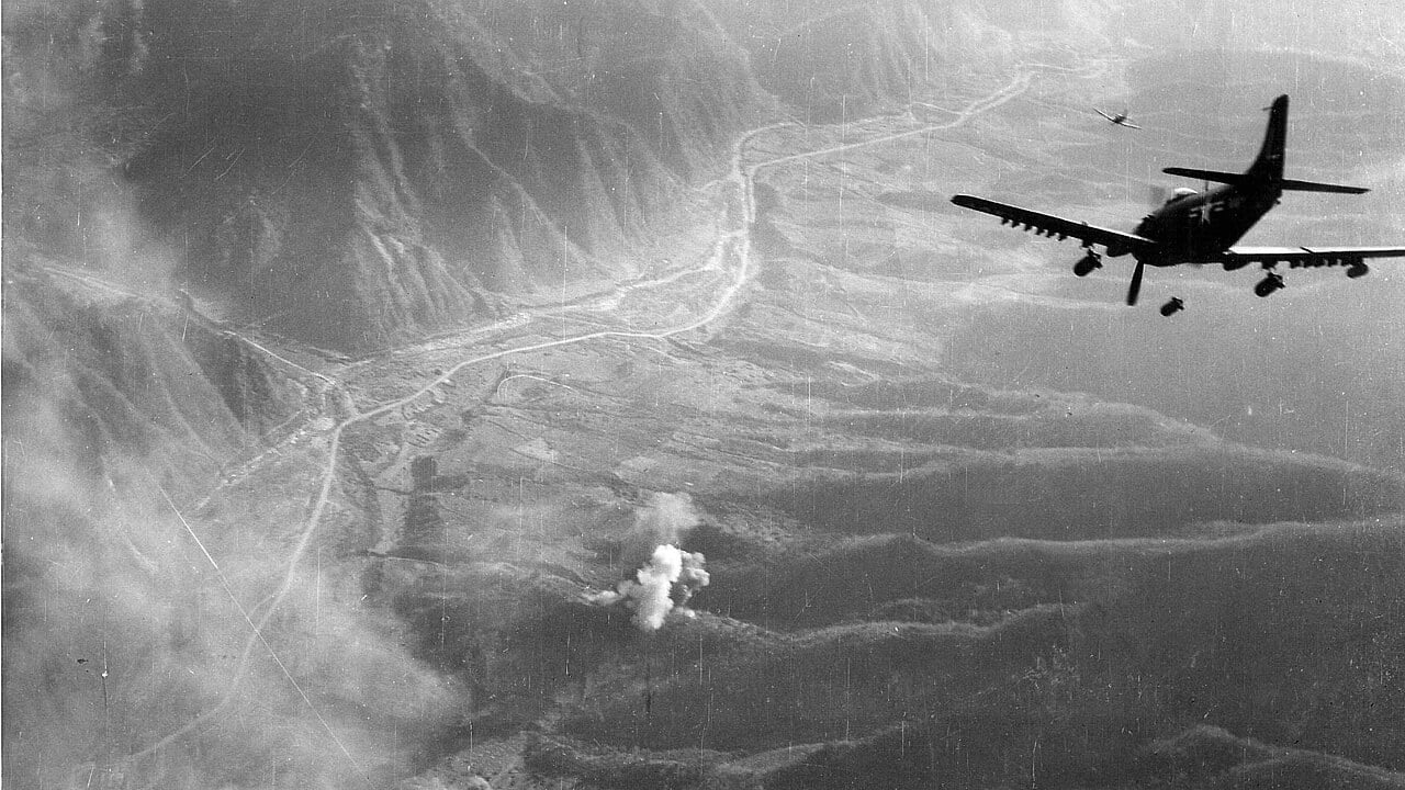 US Navy AD Skyraiders bombing targets in Korea, 1952 US Navy AD Skyraider dive bombers of Carrier Air Group 7 releasing bombs over mountainous North Korea in 1952