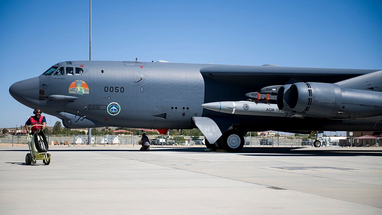 An AGM-183A ARRW hypersonic missile test vehicle mounted under the wing of a B-52H Stratofortress at Edwards Air Force Base