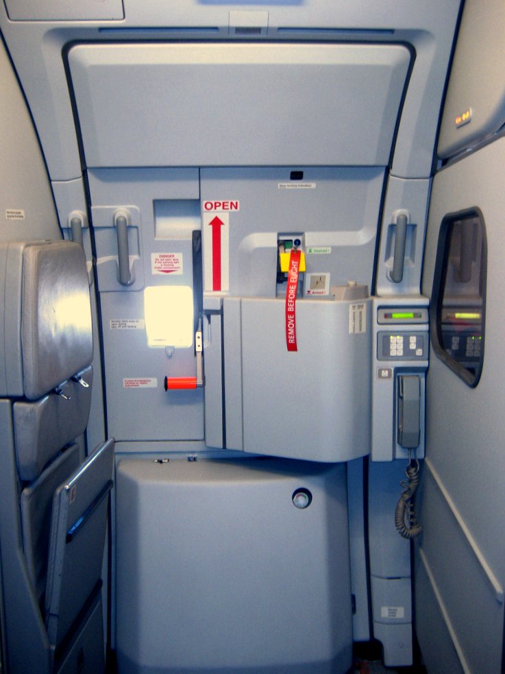 Rear passenger door of an Airbus A319 from inside the cabin