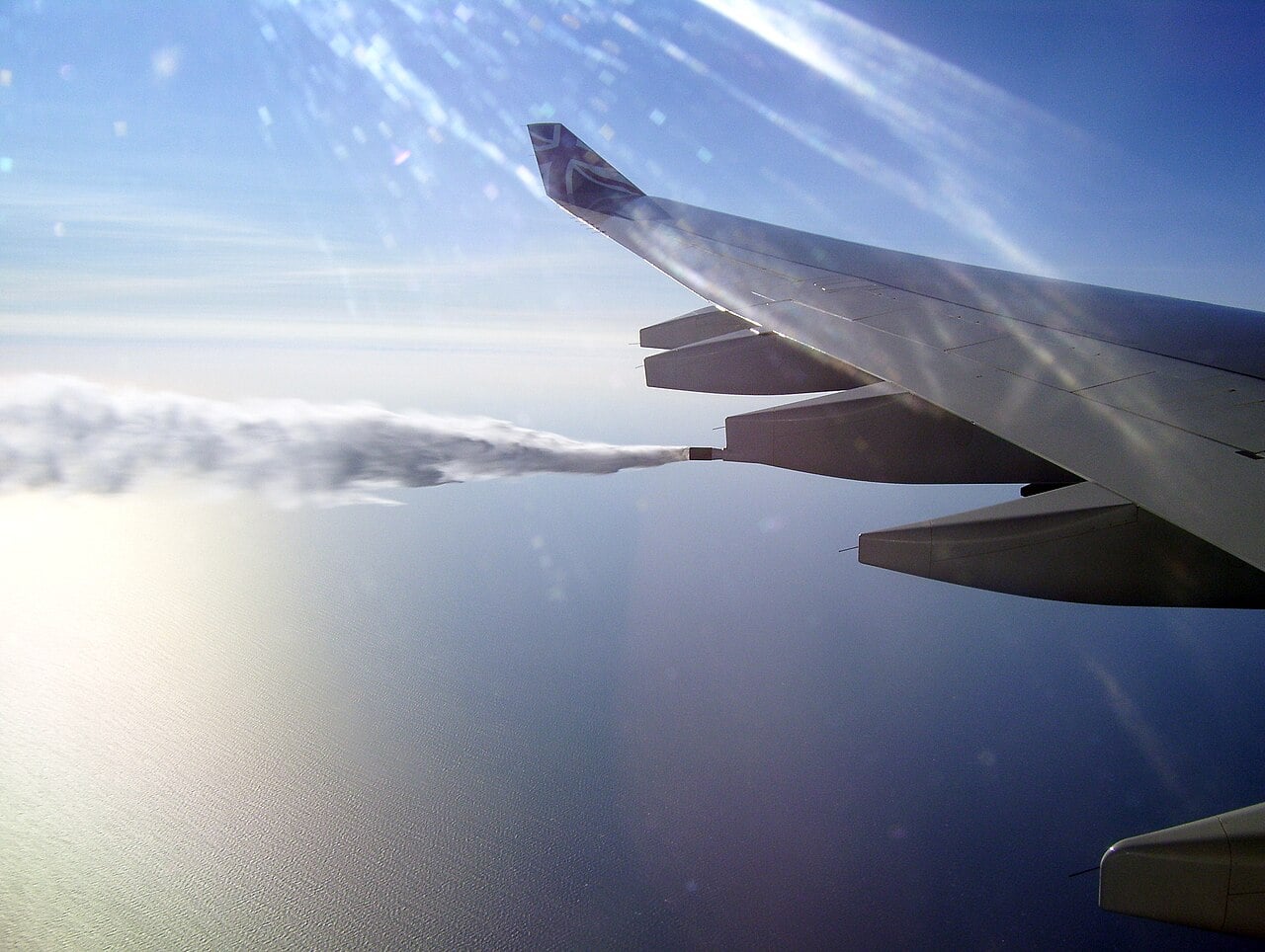 Fuel streaming from the jettison nozzle of an Airbus A340-600 over the Atlantic