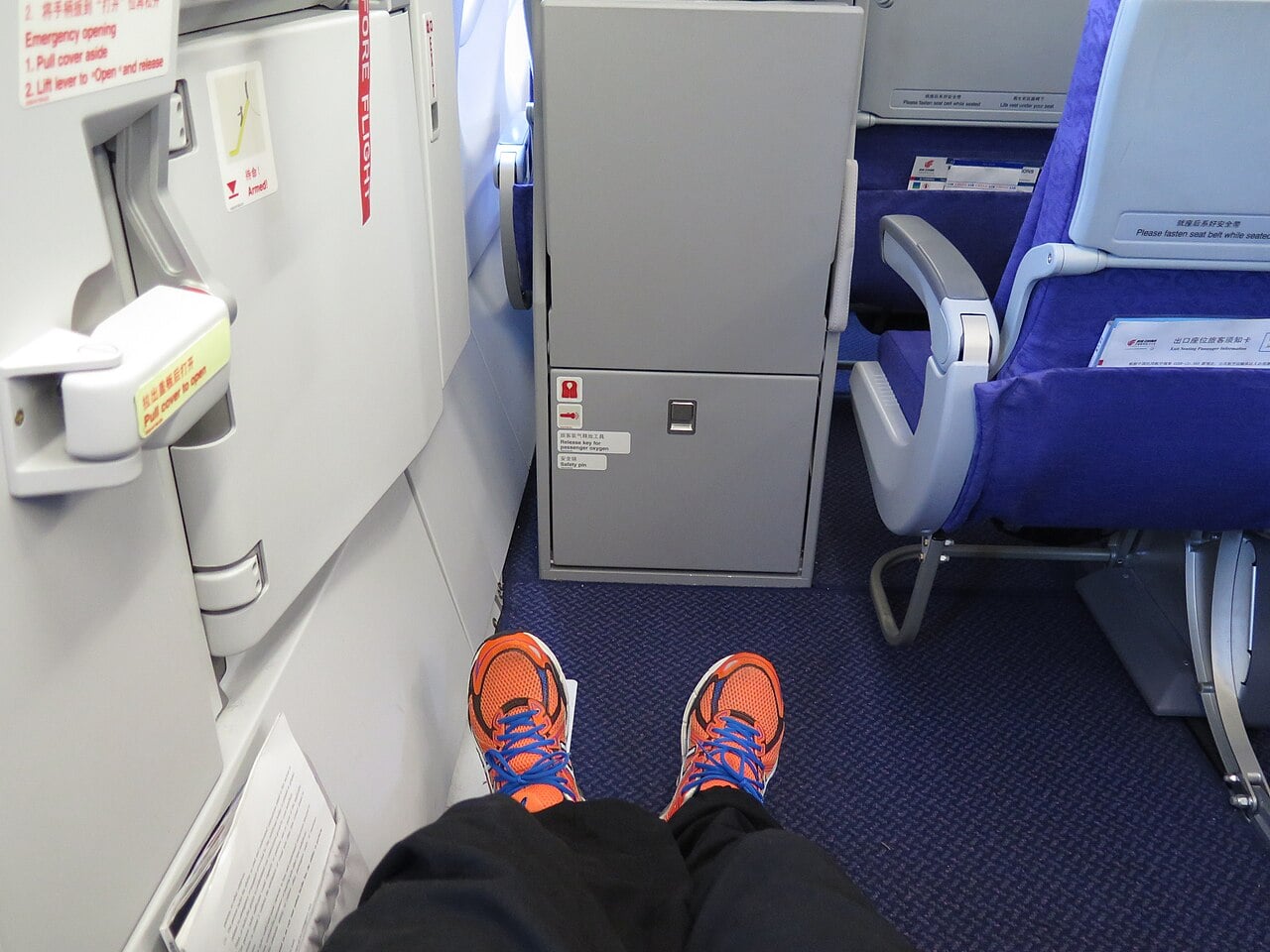 Passenger seated in an emergency exit row