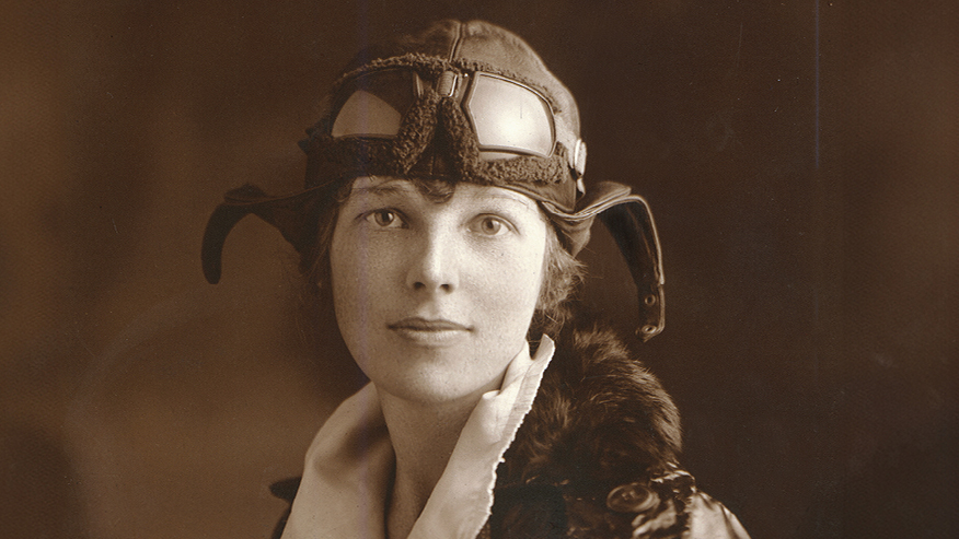 Portrait of Amelia Earhart in a leather flying helmet and goggles, 1922