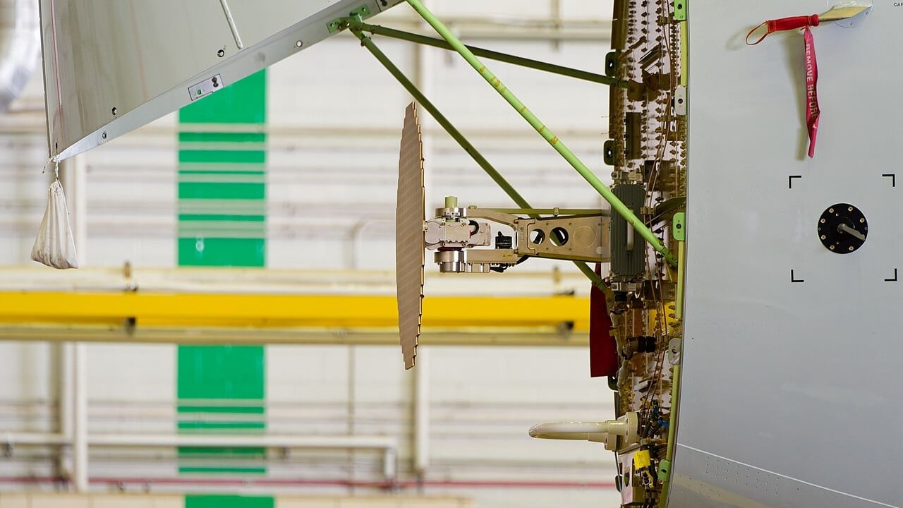 Weather radar antenna inside the open nose radome of a Boeing 737 MAX Flat-plate weather radar antenna exposed behind the open nose radome of an American Airlines Boeing 737 MAX 8