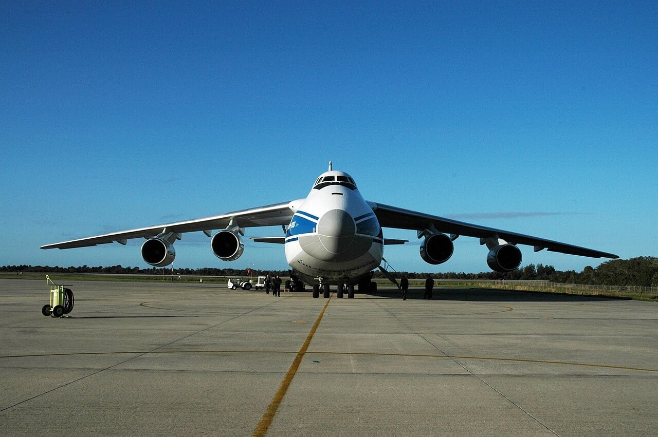 Head-on view of an Antonov An-124 Ruslan on the Shuttle Landing Facility at Kennedy Space Center, its high wings sloping down towards the tips