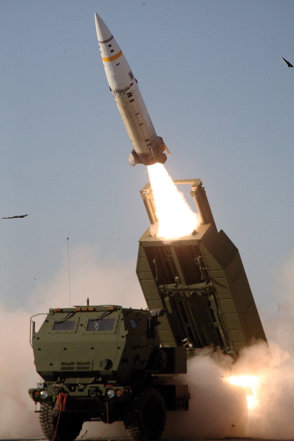 US Army M57A1 ATACMS tactical ballistic missile leaving the launch pod of an M142 HIMARS truck