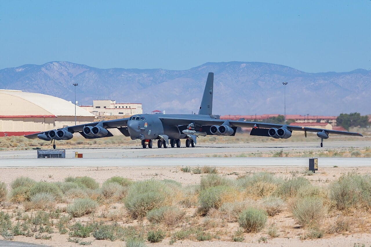 A B-52H Stratofortress of the 419th Flight Test Squadron on the runway at Edwards Air Force Base with an ARRW test vehicle under its wing