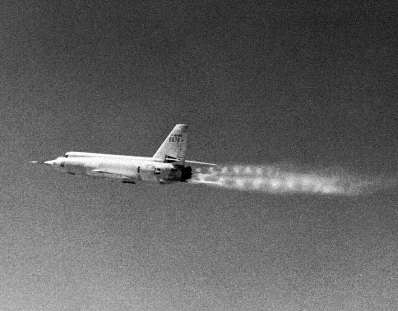 The Bell X-2 rocket research aircraft in flight, its rocket exhaust showing a twin chain of shock diamonds
