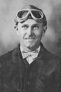 Portrait of Ben T. Epps wearing a leather flying helmet and goggles around 1910