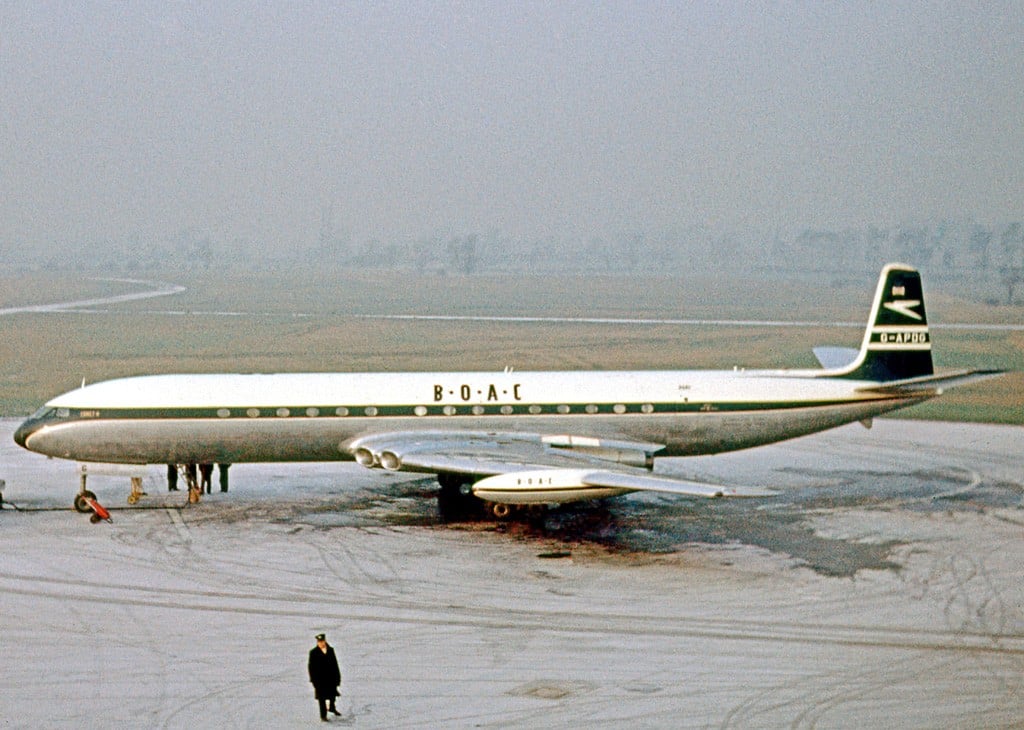 BOAC de Havilland Comet 4 jetliner G-APDG parked on a snowy apron at Manchester Airport in 1963