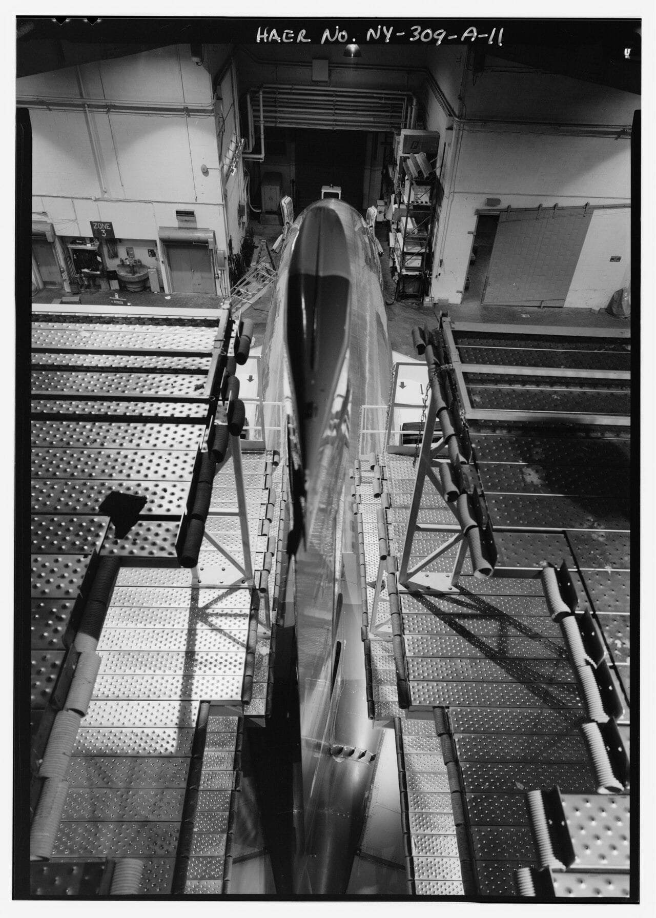 Boeing 737-200 fuselage in a maintenance hangar tail dock