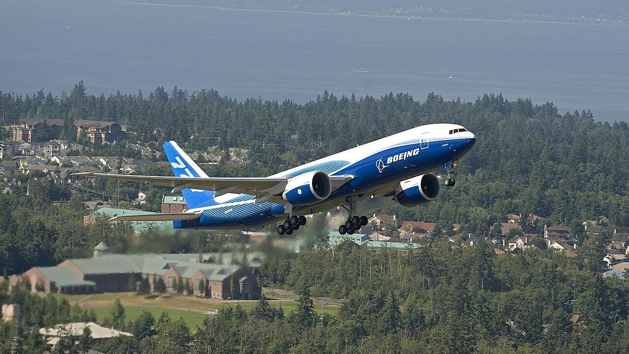 The first Boeing 777 Freighter in Boeing house colours climbing away from Paine Field, Everett, on its first flight in July 2008