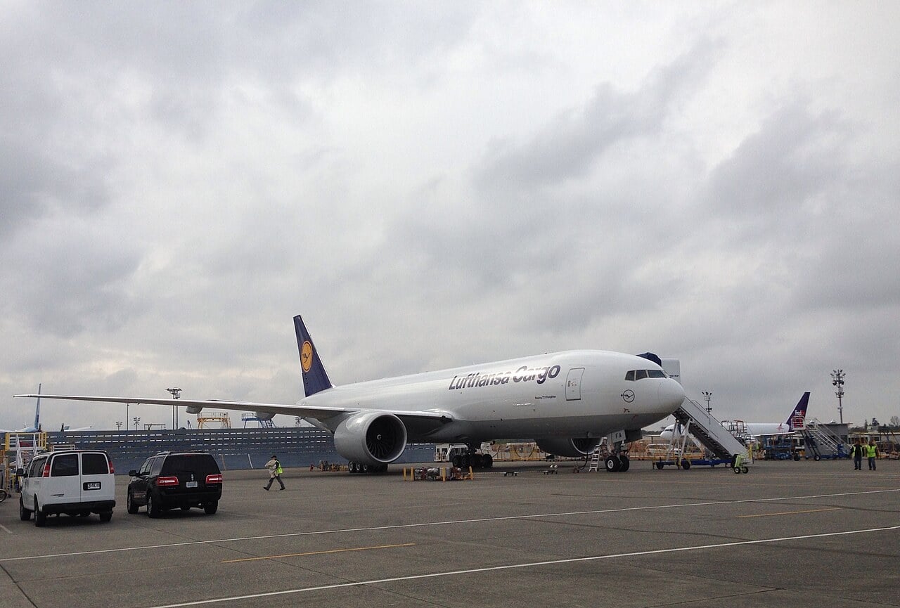 A white Lufthansa Cargo Boeing 777 Freighter parked on the ramp at Boeing Everett awaiting delivery