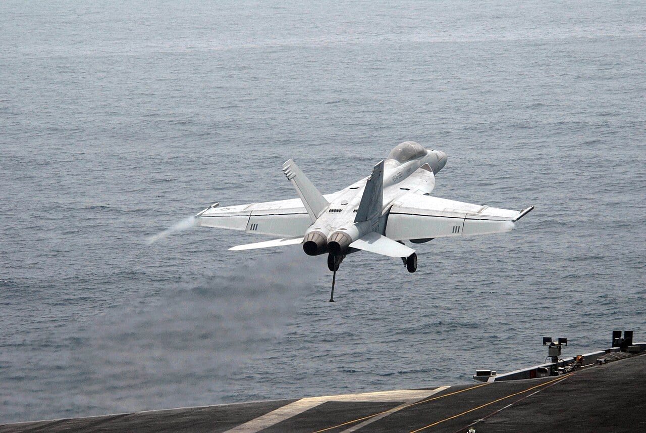 US Navy F/A-18F Super Hornet climbing away from the deck of USS Ronald Reagan after a bolter