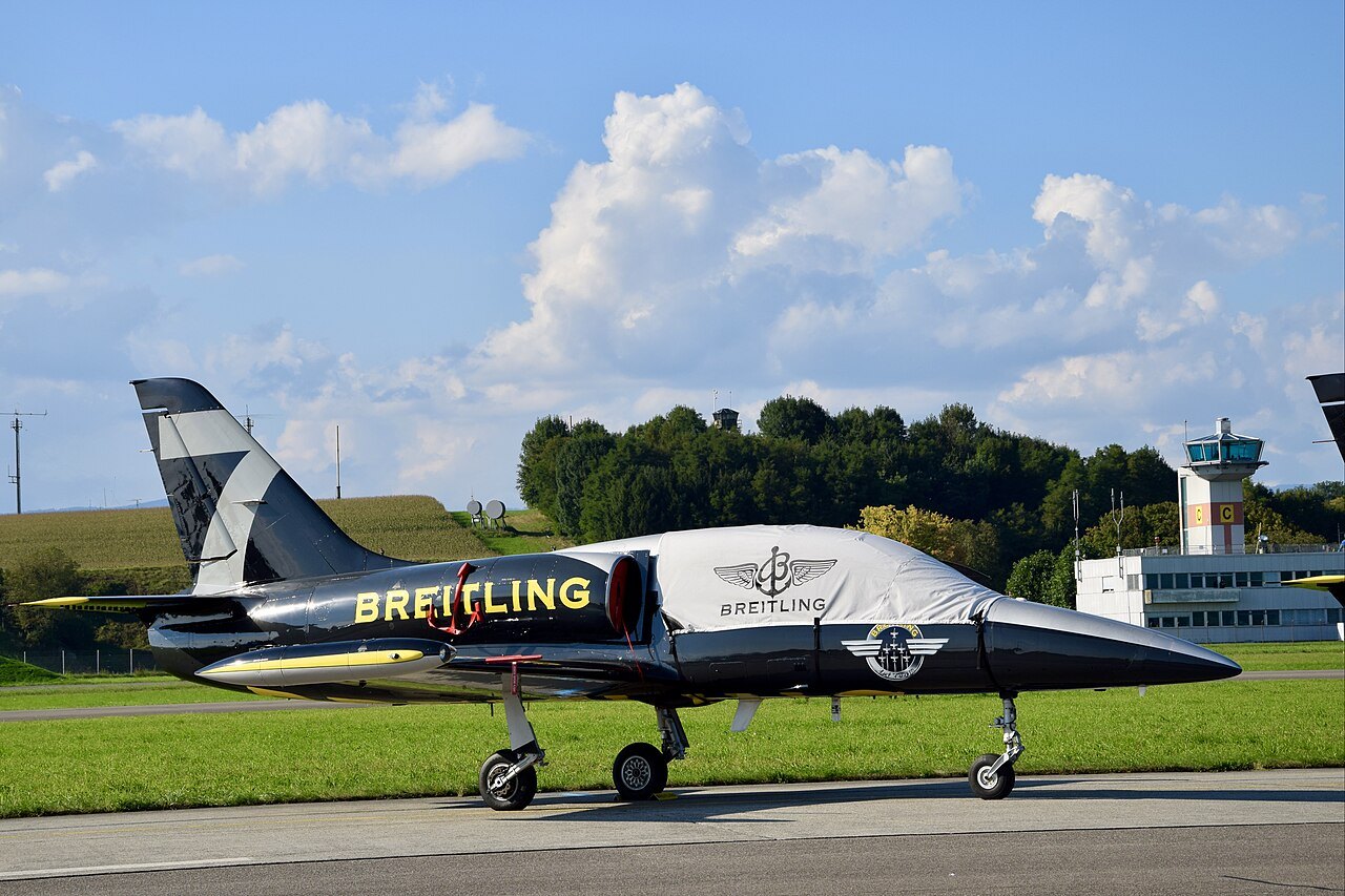 A black Breitling Jet Team Aero L-39 Albatros parked on the apron at Payerne, Switzerland