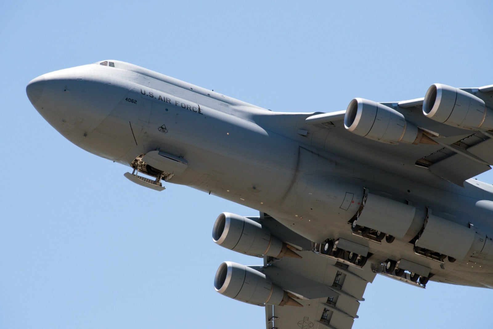 Underside of a U.S. Air Force C-5M Super Galaxy after take-off from Travis Air Force Base showing its main landing gear bays