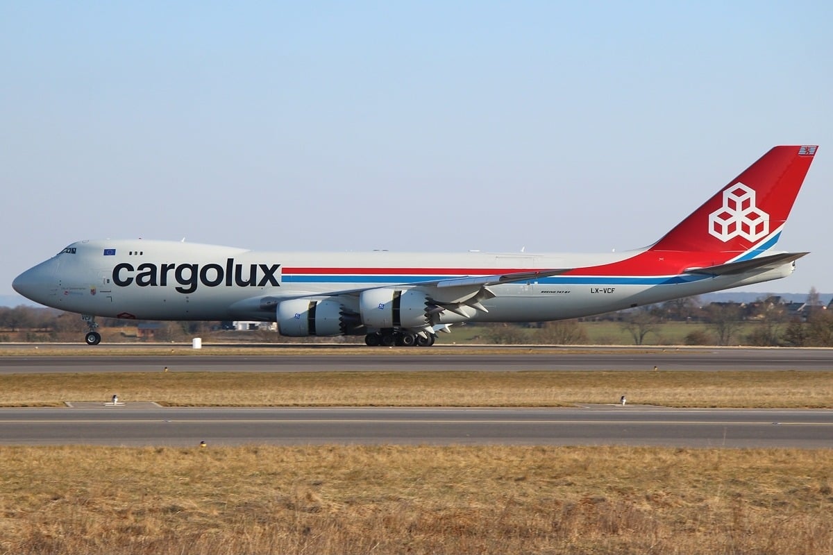 Cargolux Boeing 747-8F LX-VCF rolling at Luxembourg Findel airport, its wing and body main landing gear visible
