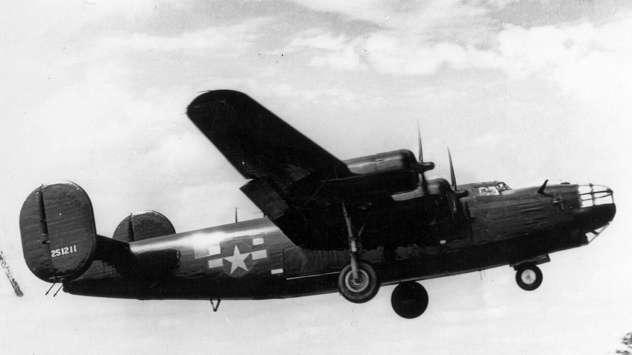 Black Carpetbagger B-24 Liberator Miss Fitts taking off from Harrington Black-painted B-24 Liberator 42-51211 Miss Fitts of the 492nd Bomb Group Carpetbaggers taking off from Harrington