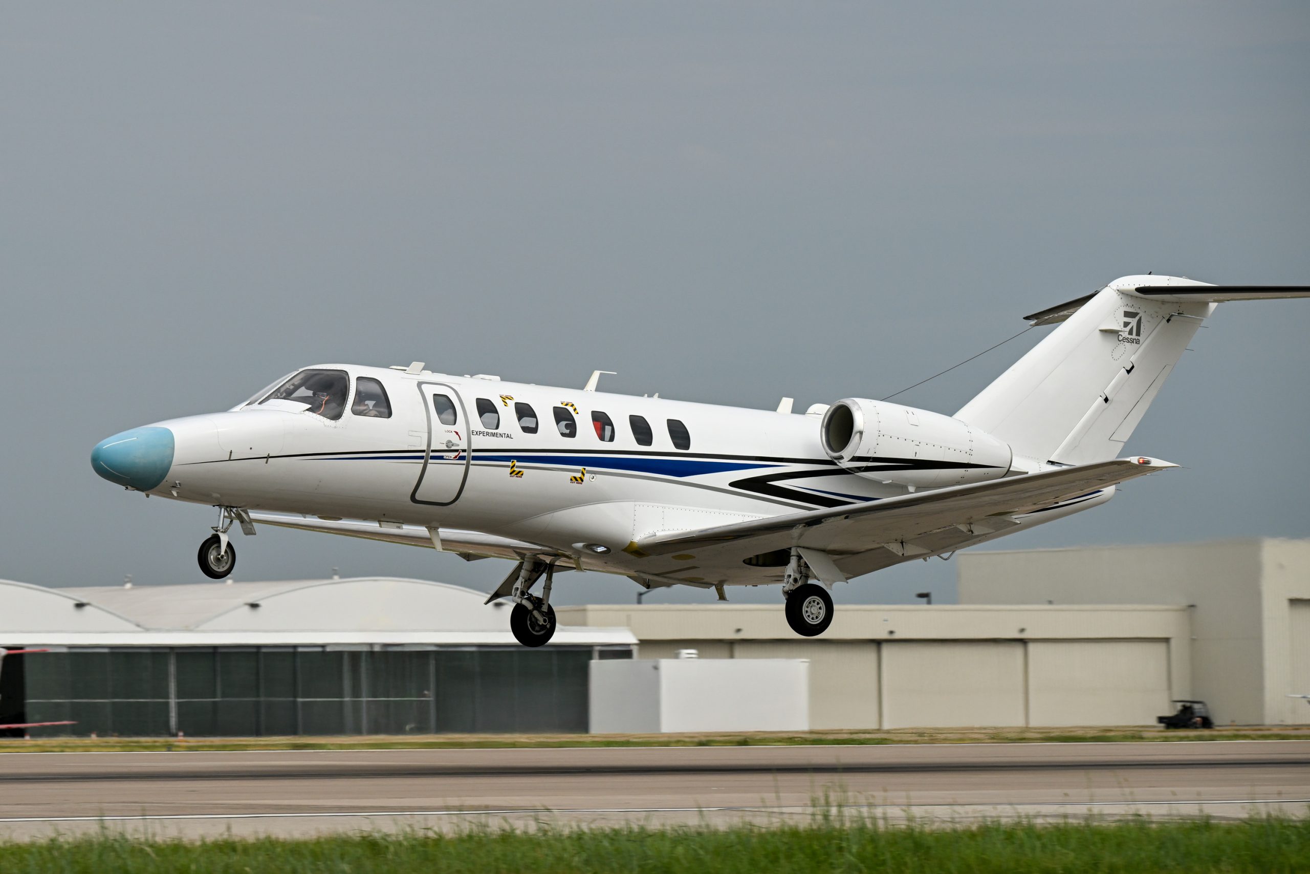 Cessna Citation CJ3 Gen3 prototype in Textron flight-test markings lifting off from the runway at Wichita
