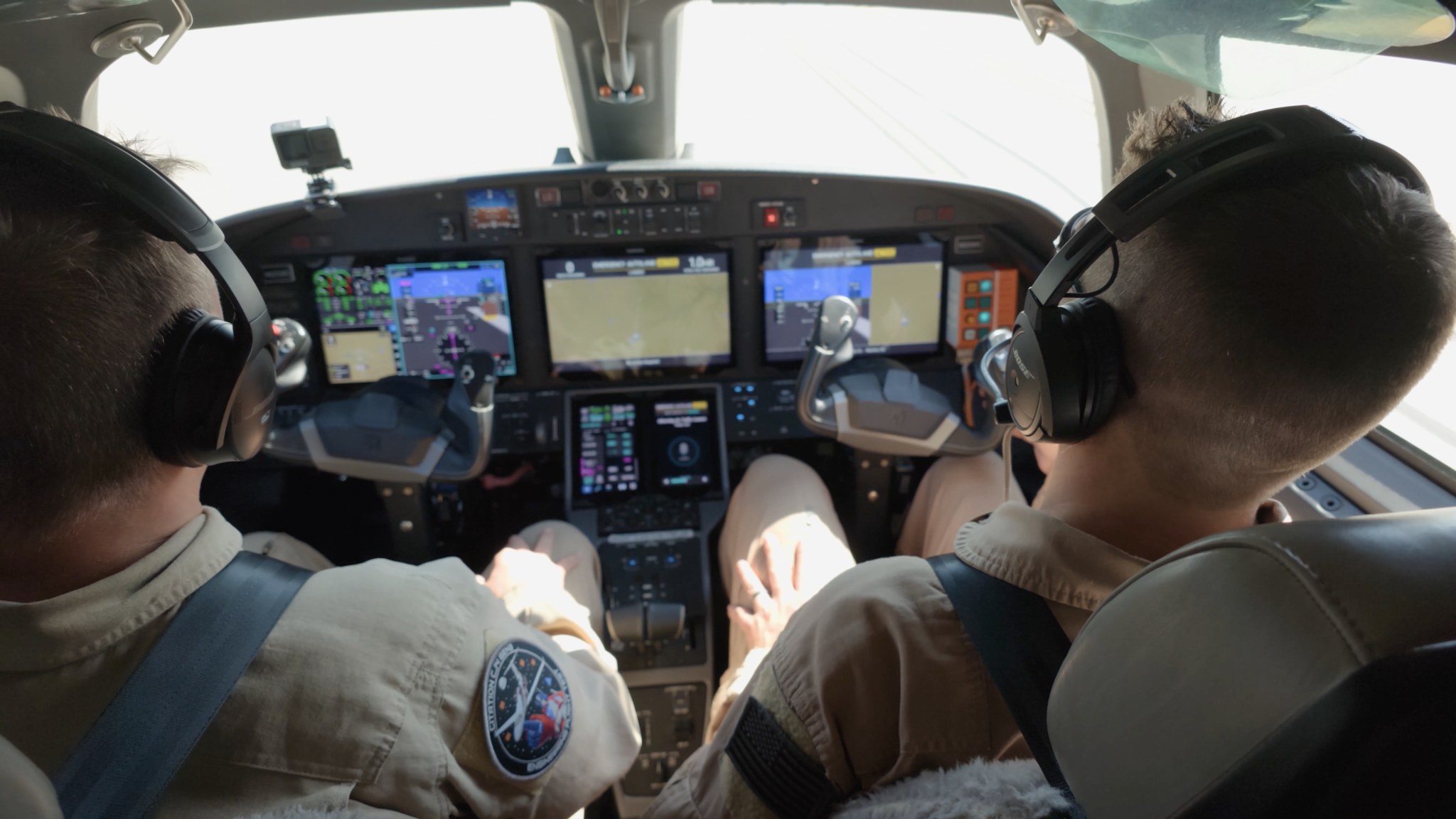 Two Textron flight test pilots in the cockpit of a Cessna Citation CJ4 Gen3 test article with Garmin displays