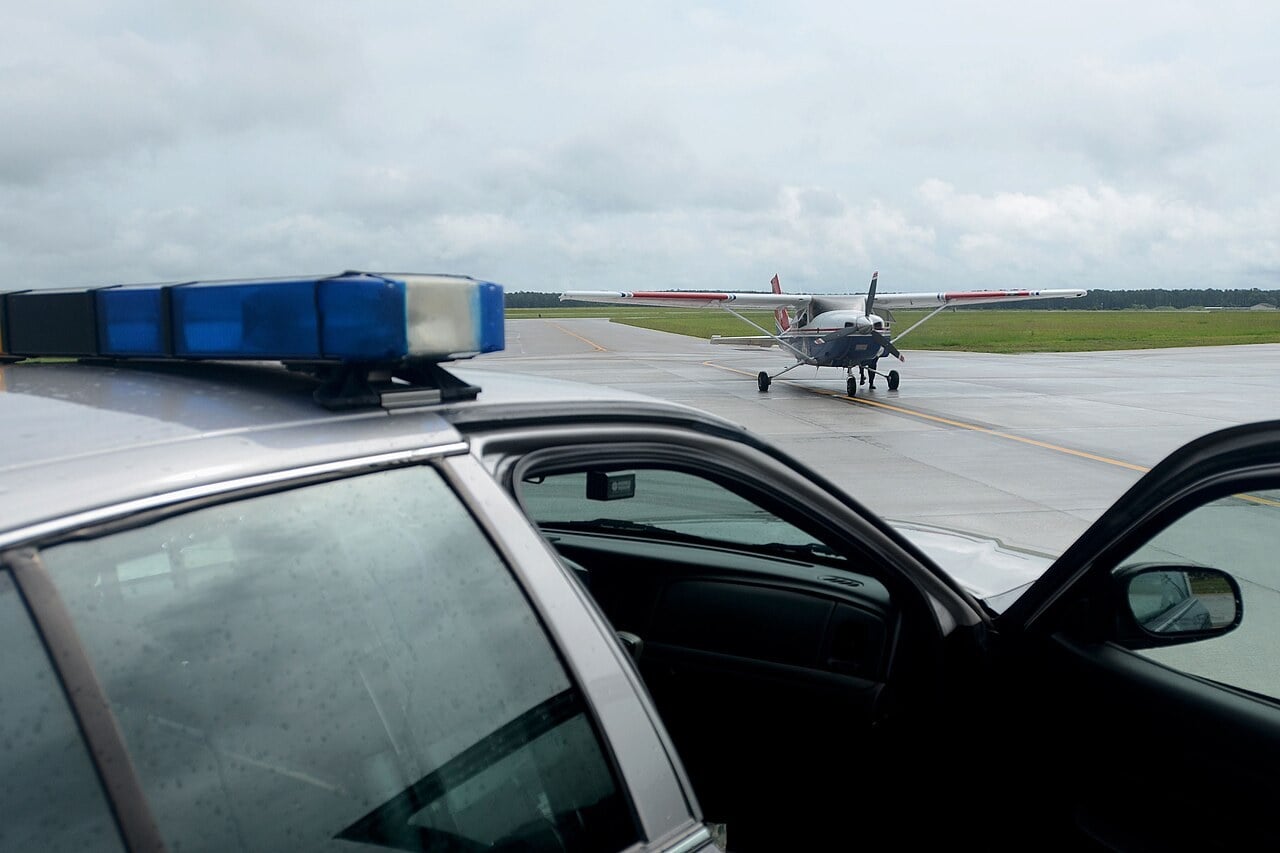 A Cessna 182 taxiing towards a waiting sheriff's patrol car after being intercepted by F-16s during an Aerospace Control Alert exercise in South Carolina