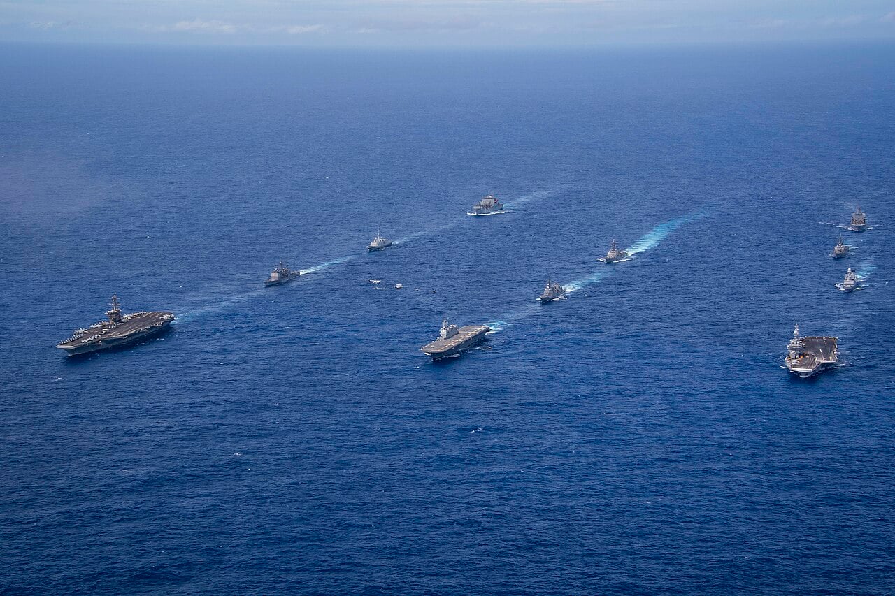 French carrier Charles de Gaulle sailing with US, Japanese and French ships in formation in the Philippine Sea