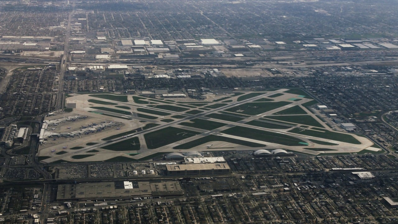 Chicago Midway International Airport from the air, runways hemmed in by the street grid Aerial view of Chicago Midway International Airport hemmed in by the Chicago street grid