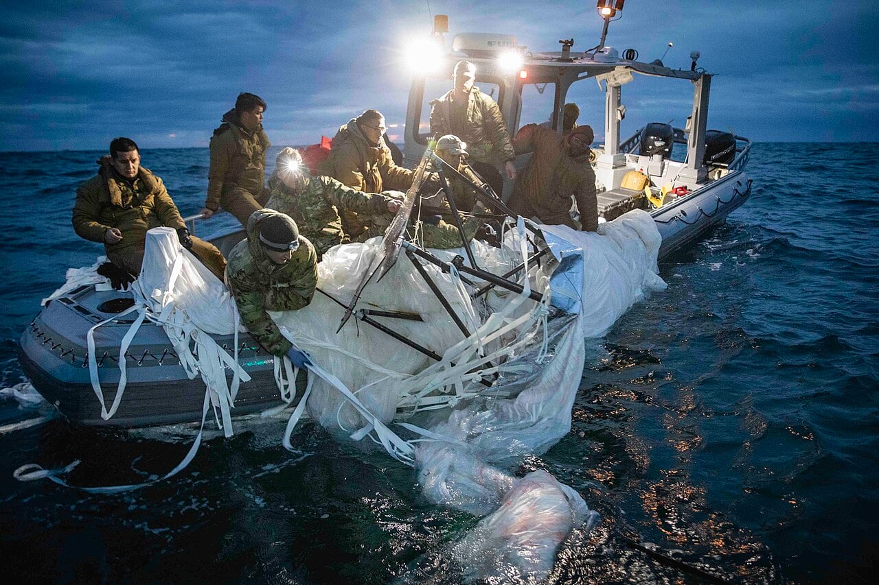 US Navy sailors recover the Chinese high-altitude balloon envelope off South Carolina, February 2023