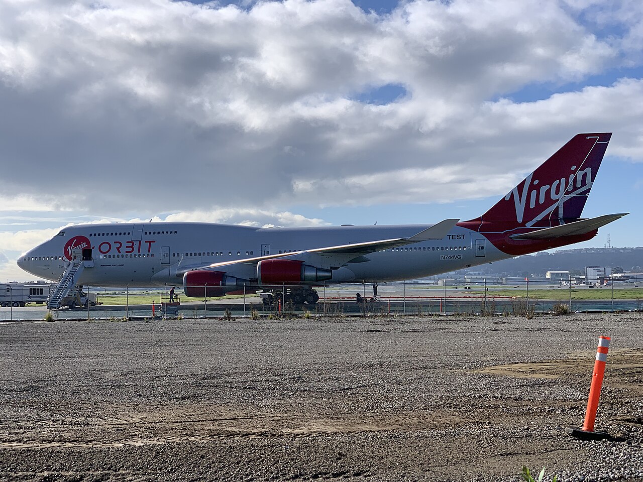 The Boeing 747-400 Cosmic Girl in Virgin Orbit colours at Long Beach Airport, with the launch pylon on the port wing