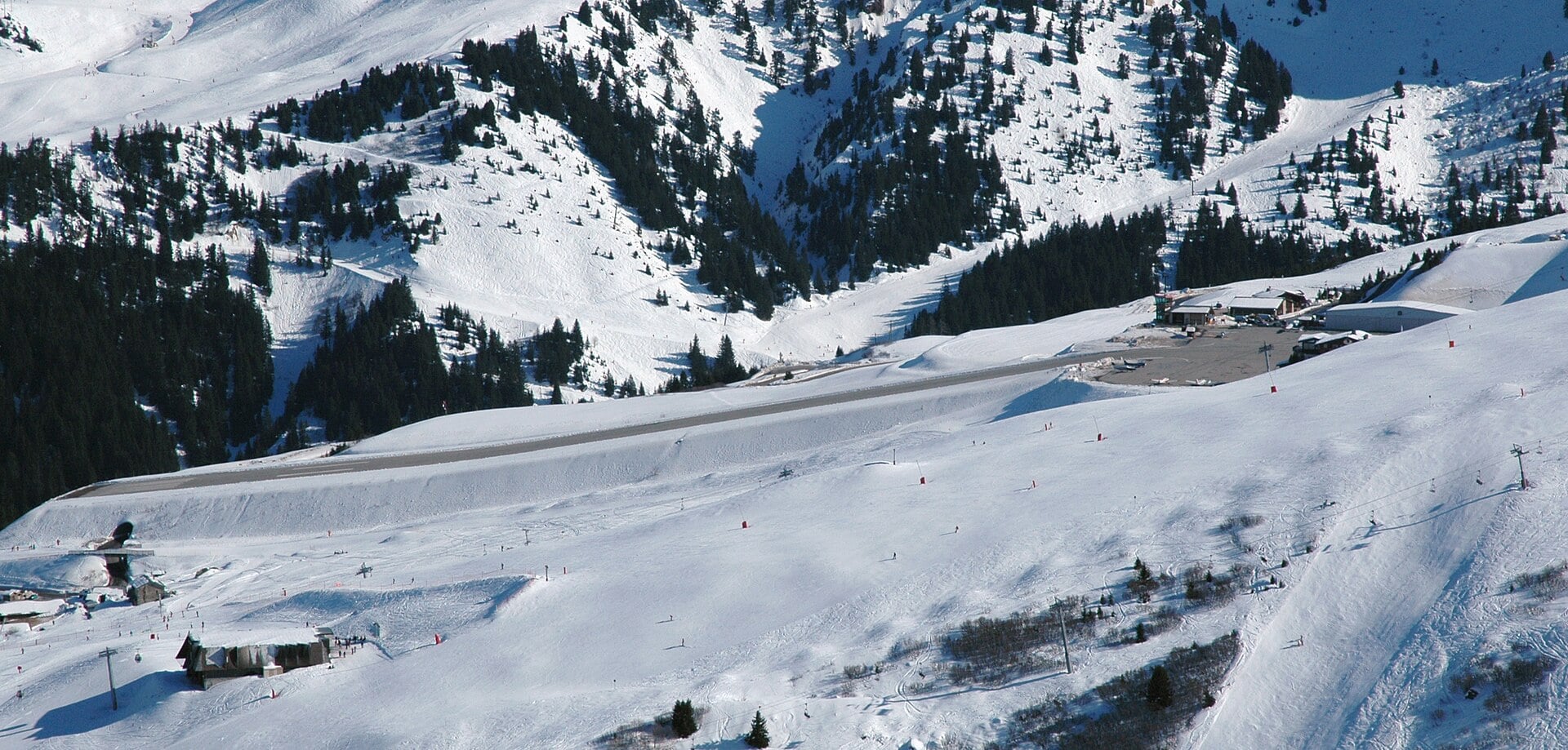 Courchevel Altiport runway seen in profile across the valley