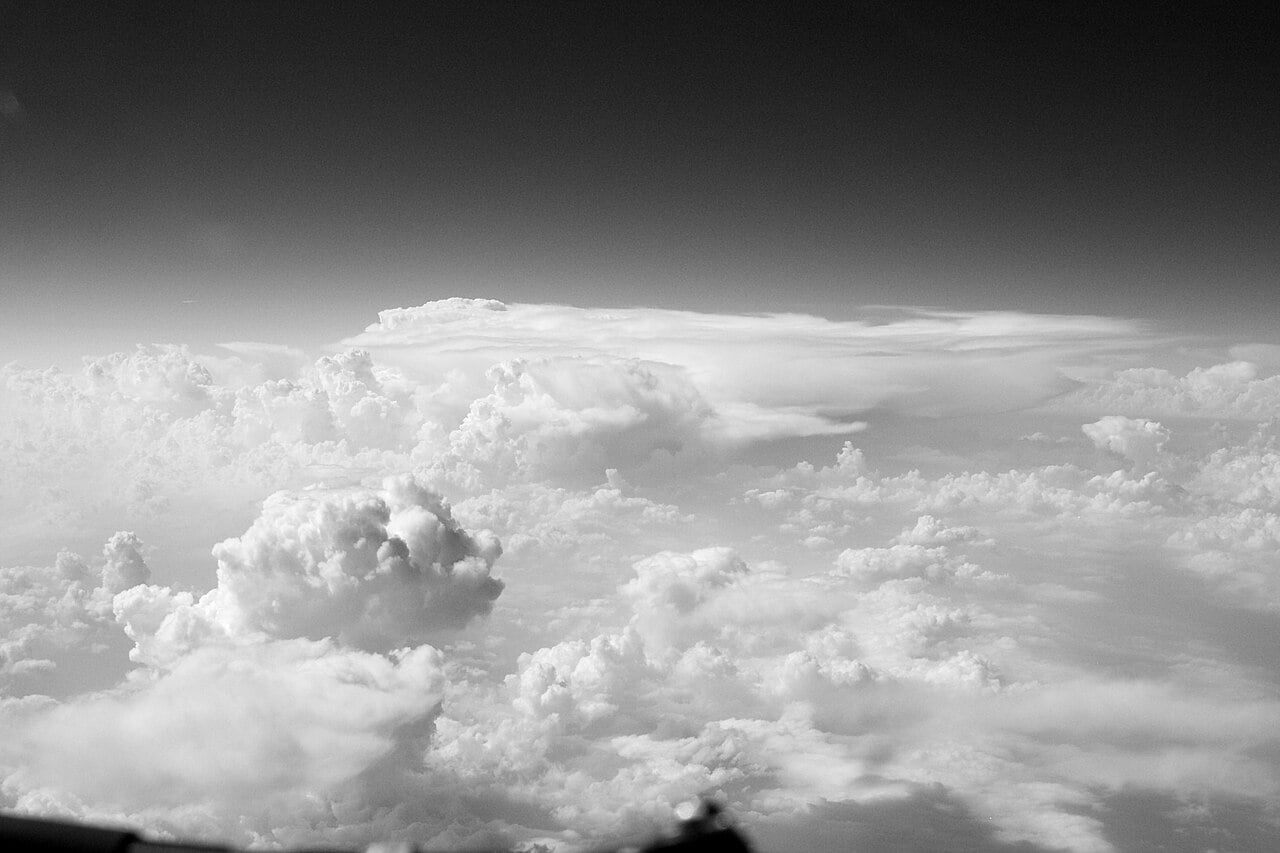 Towering cumulonimbus clouds seen from a Boeing 737 in flight, the same storms shown on its weather radar