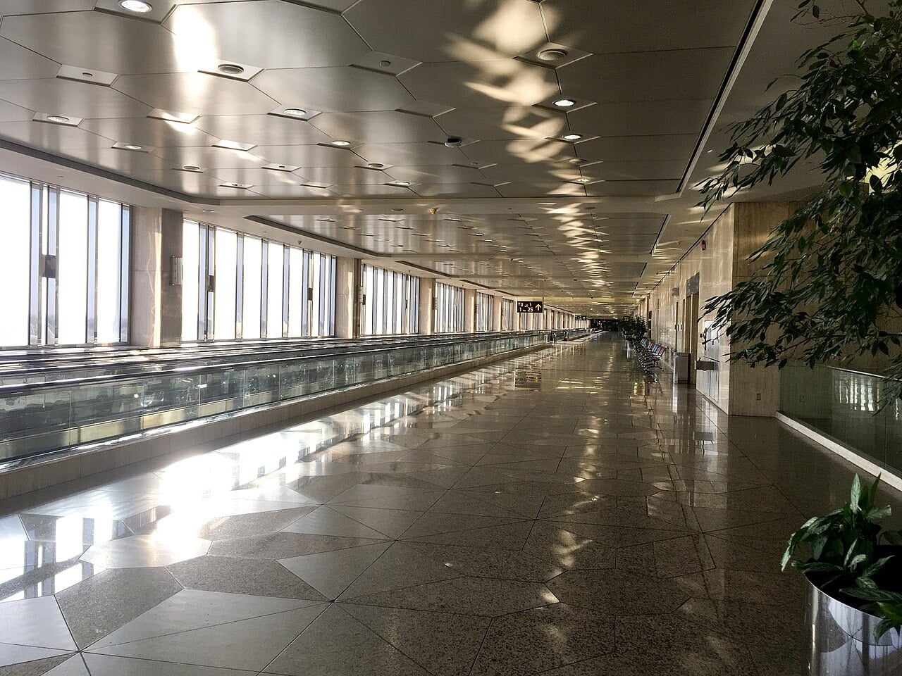 Long empty concourse with moving walkways at King Fahd International Airport, Dammam
